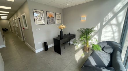 Modern waiting area at By Serwah Wellness wimbledon, London, England, GB, featuring elegant decor and natural light.
