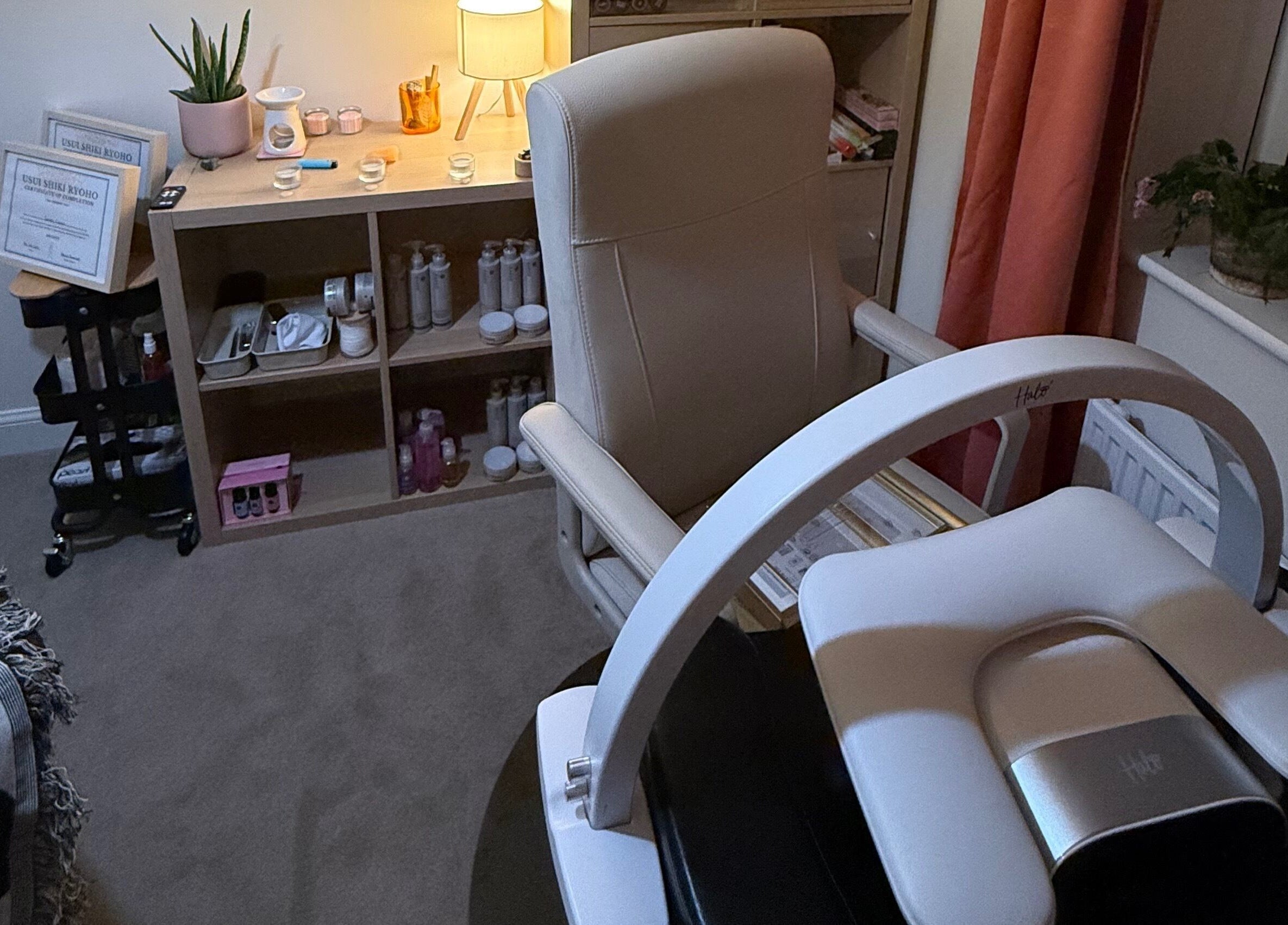 Modern treatment room at Essence Beauty, Barnsley, England, GB featuring sleek chair and skincare products.