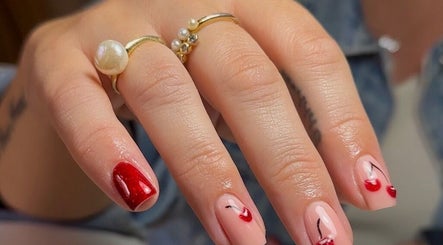 Stylish cherry nail art at Olive Studio, Mansfield, England, GB enhances beauty and wellness.