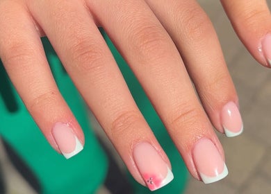 Elegant French manicure at Olive Studio, Mansfield, England, GB showcasing intricate nail art design.