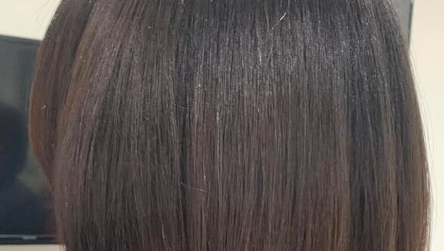 Sleek, shiny hair styled at Ashmor Hair and Beauty in East Kilbride, Scotland, GB.