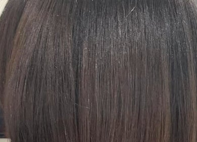 Sleek, shiny hair styled at Ashmor Hair and Beauty in East Kilbride, Scotland, GB.