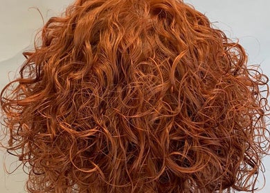 Rich copper curly hairstyle from Ashmor Hair and Beauty in East Kilbride, Scotland, GB.