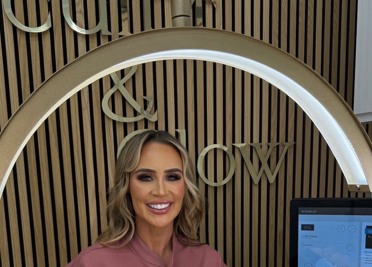 Welcoming smile at Sculpt and Glow by Katrina, Brentwood, England, GB, under stylish decor.