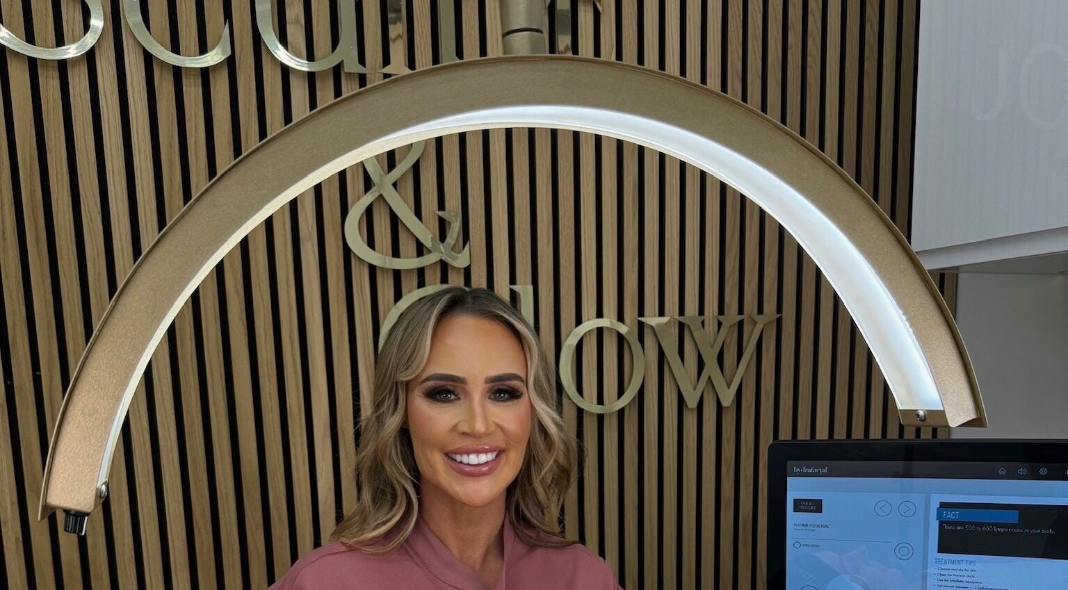 Welcoming smile at Sculpt and Glow by Katrina, Brentwood, England, GB, under stylish decor.