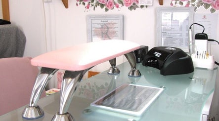 Rambling Rose Nails' chic station in Mangawhai, Northland, NZ, showcasing modern tools and a serene setting.