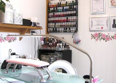Nail polish display at Rambling Rose Nails, Mangawhai, Northland, NZ, showcasing various vibrant colors.