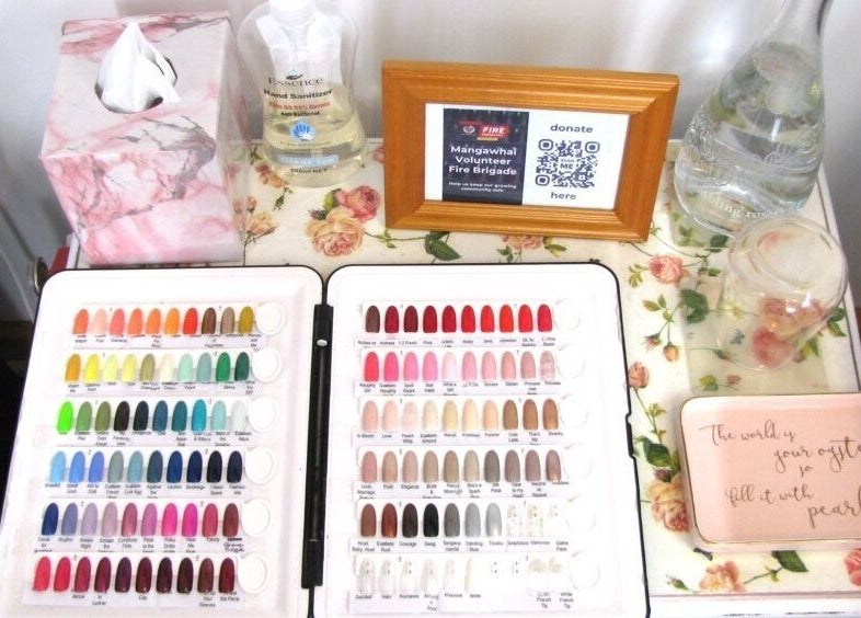 Colorful nail polish palette at Rambling Rose Nails in Mangawhai, Northland, NZ, displaying vibrant options.