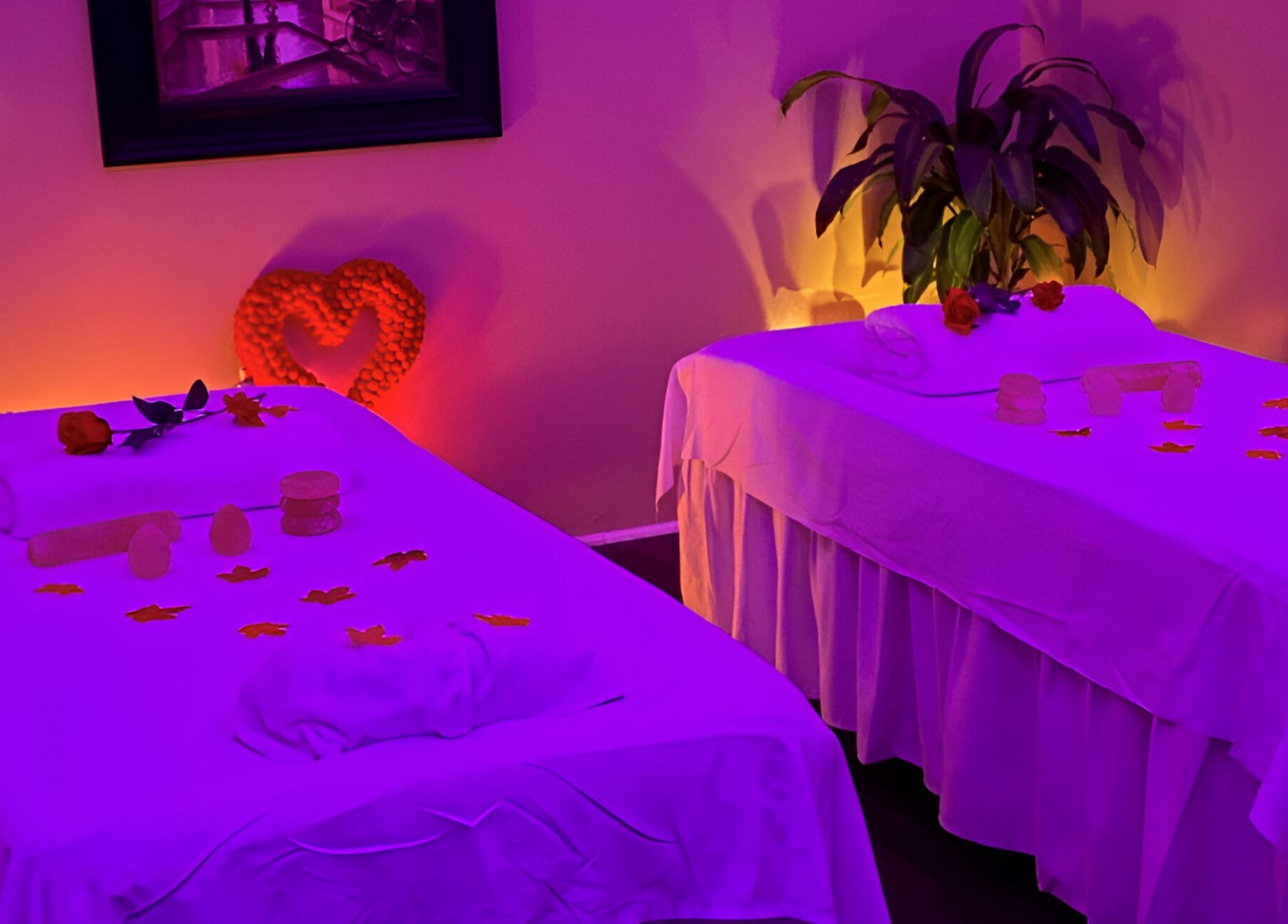 Relaxing massage room at Chi Foot Spa in Williamsburg, Virginia, US with serene lighting and decor.