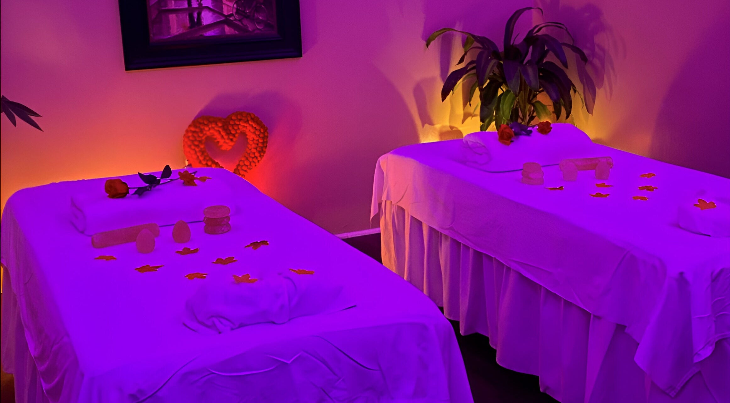Relaxing massage room at Chi Foot Spa in Williamsburg, Virginia, US with serene lighting and decor.