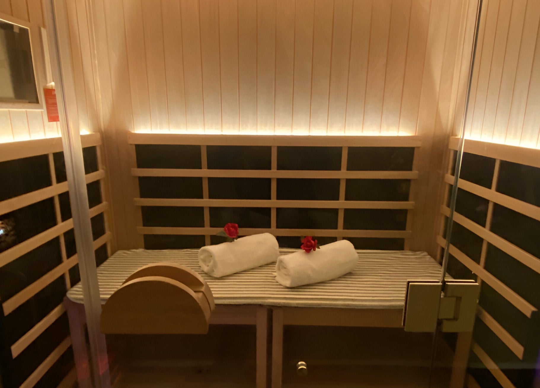 Luxurious sauna at Chi Foot Spa with towels and roses in Williamsburg, Virginia, US.