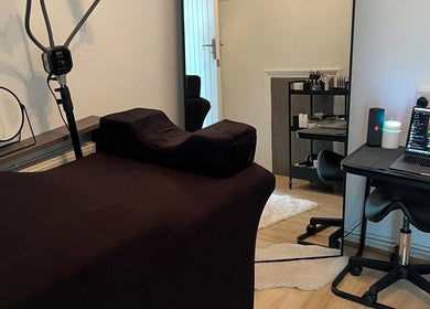 Tranquil treatment room at Signature Aesthetics, London, England, GB featuring a therapy bed and sleek décor.