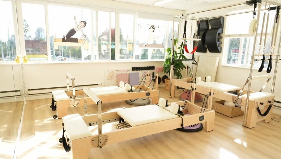 Bright Pilates studio at Li Pilates, Burnaby, British Columbia, CA with modern equipment and natural light.