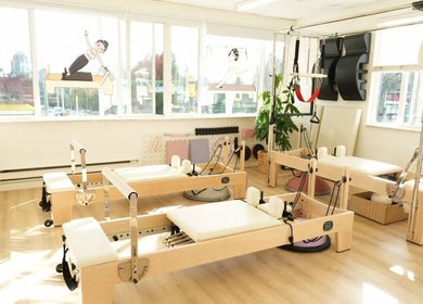 Bright Pilates studio at Li Pilates, Burnaby, British Columbia, CA with modern equipment and natural light.