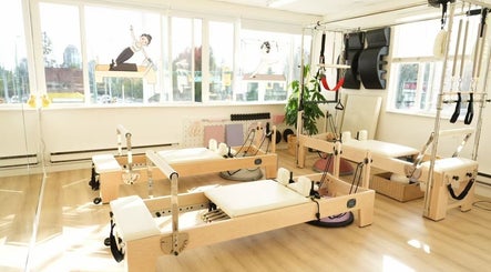 Bright Pilates studio at Li Pilates, Burnaby, British Columbia, CA with modern equipment and natural light.