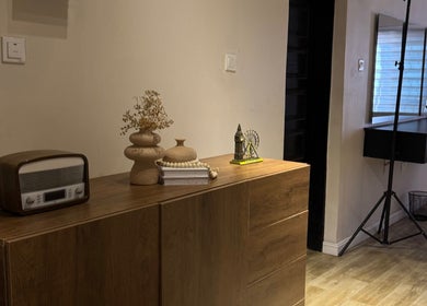 Elegant interior of NinnieStudioCo, Lagos with vintage decor and wooden accents.