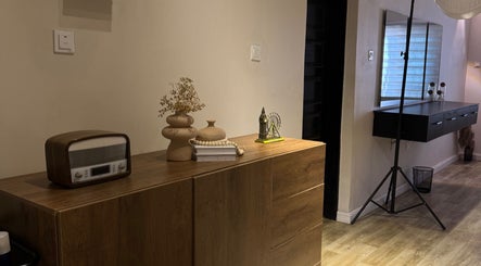 Elegant interior of NinnieStudioCo, Lagos with vintage decor and wooden accents.