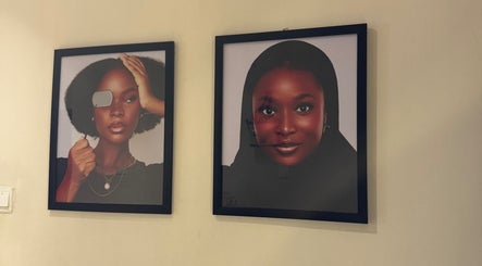Framed portraits at NinnieStudioCo showcasing stylish designs in Lagos, Lagos, NG.
