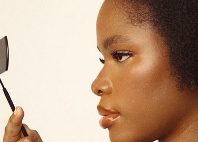 Close-up of a model with a mirror at NinnieStudioCo, Lagos, Lagos, NG showcasing skincare and beauty.