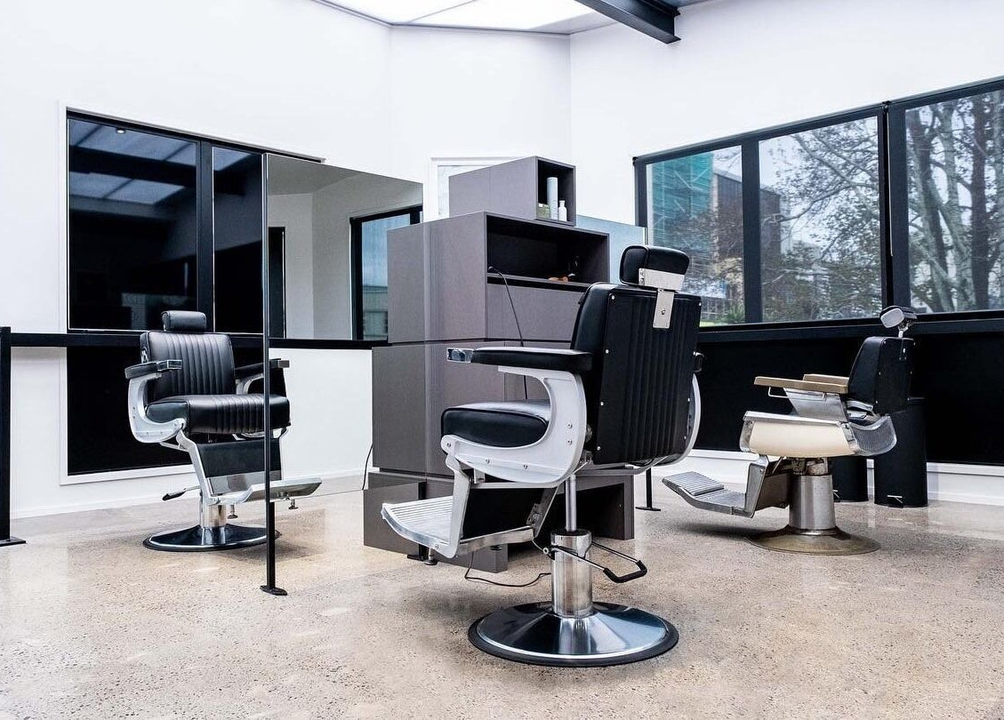Modern salon chairs at Urban Goose in Auckland, NZ, showcasing sleek interior design and elegance.