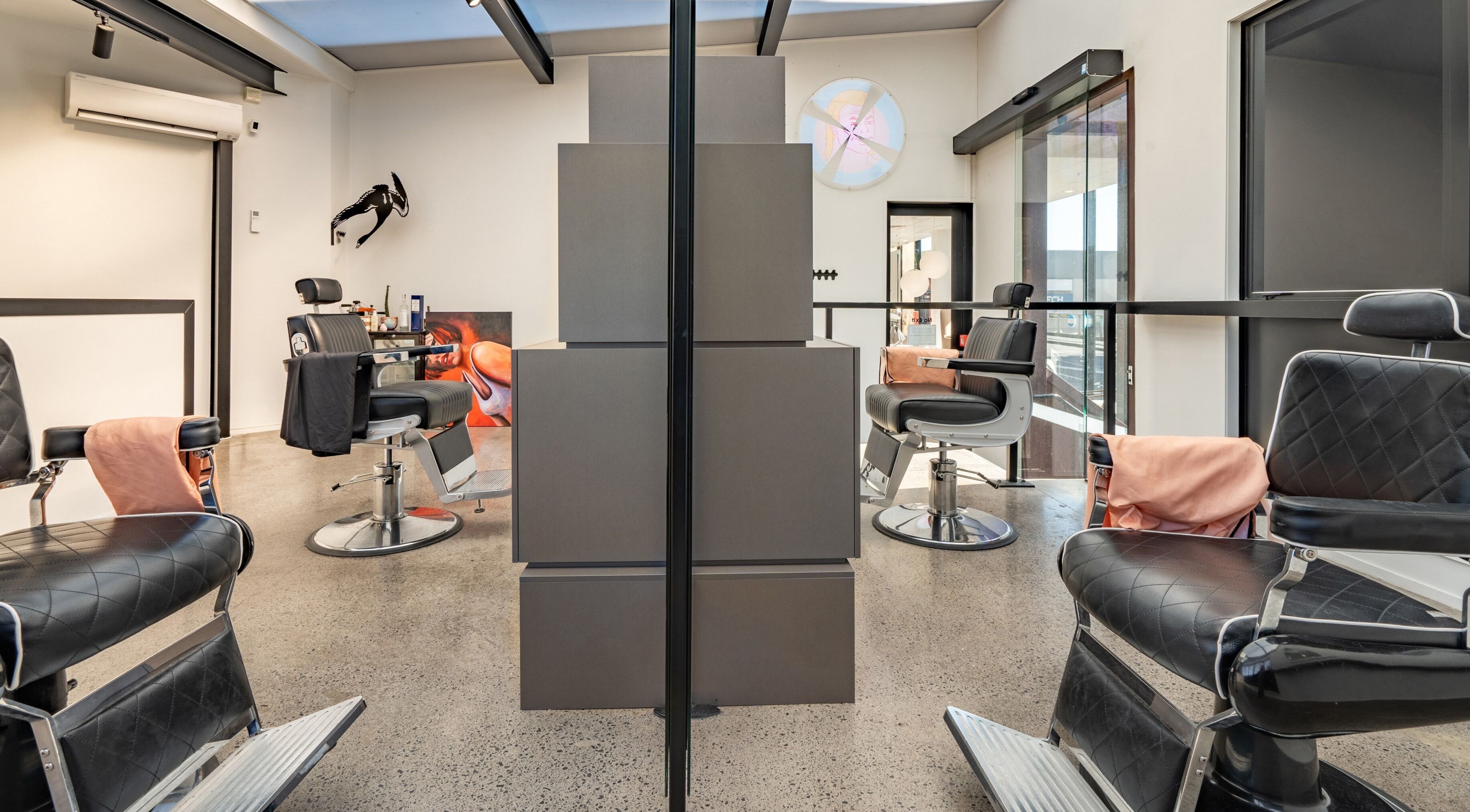 Modern barber chairs in Urban Goose at Auckland, Auckland, NZ, featuring sleek interior design.