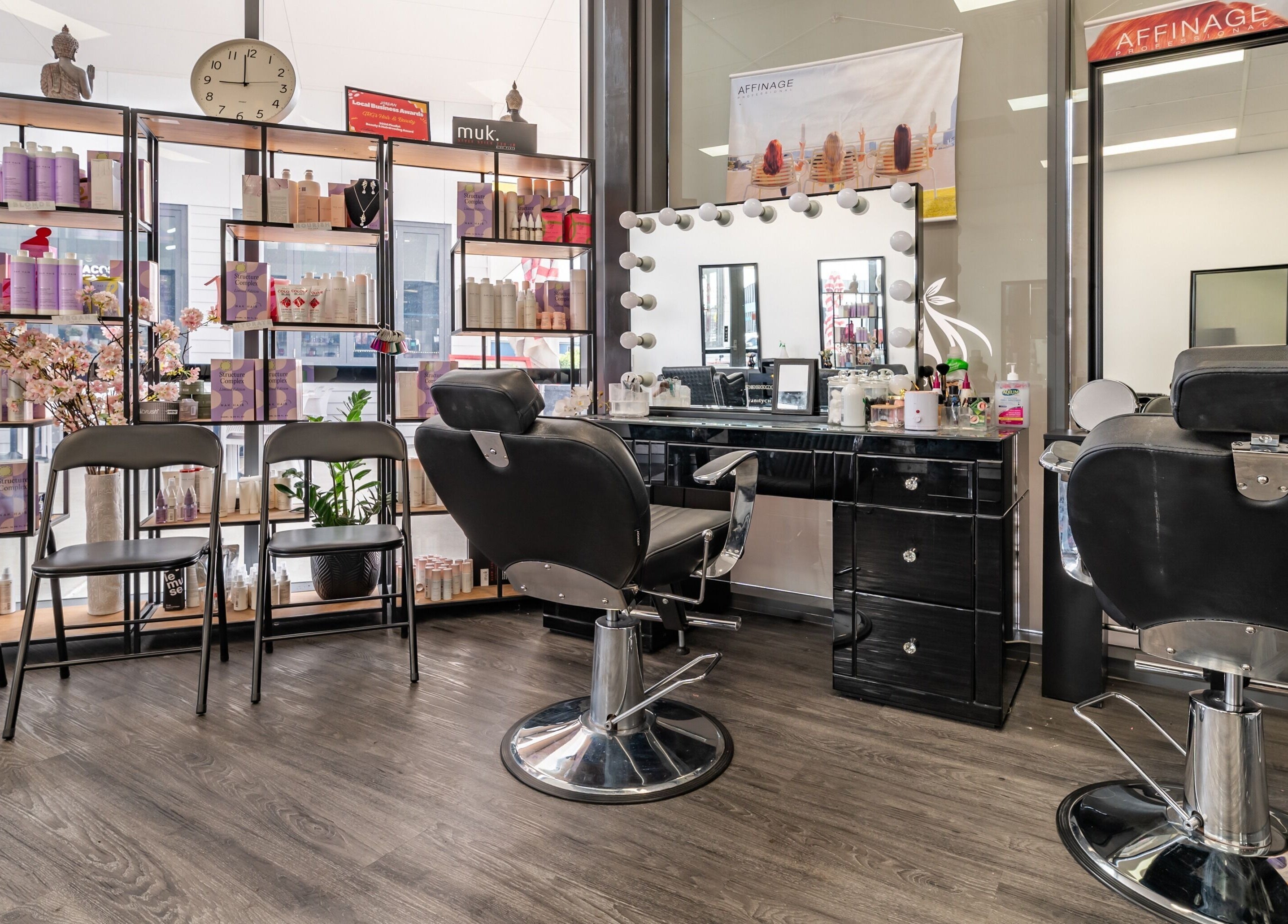 Interior of GRG’s Hair & Beauty in Spring Mountain, Queensland, AU, showcasing stylish salon chairs and beauty products.