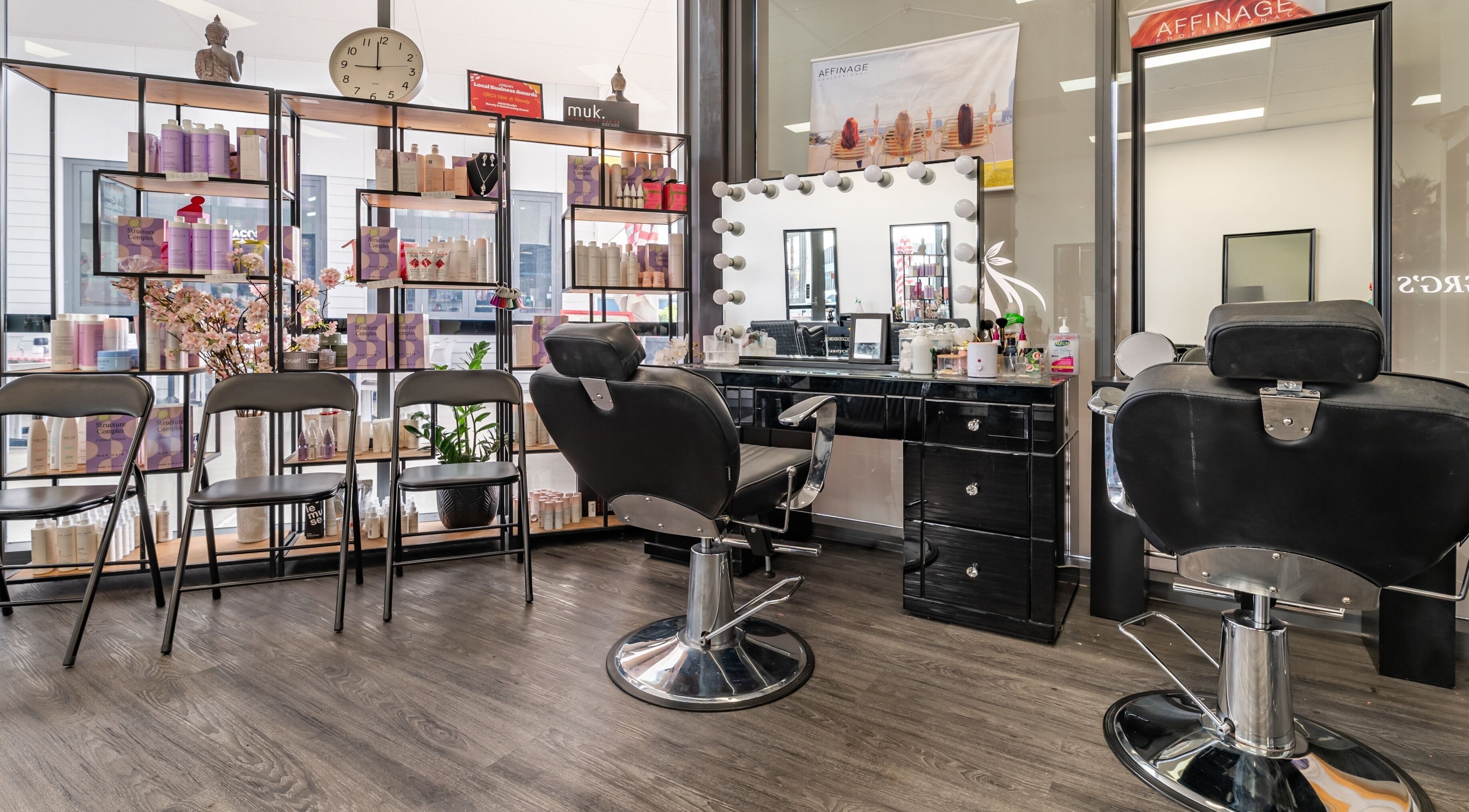 Interior of GRG’s Hair & Beauty in Spring Mountain, Queensland, AU, showcasing stylish salon chairs and beauty products.