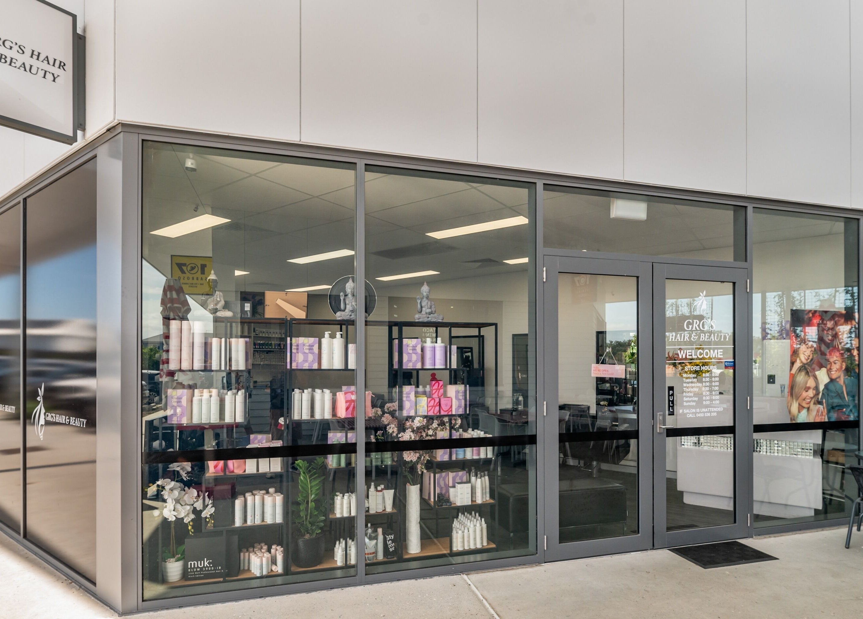 Exterior of GRG’s Hair & Beauty in Spring Mountain, Queensland, AU, showcasing modern design and product displays.