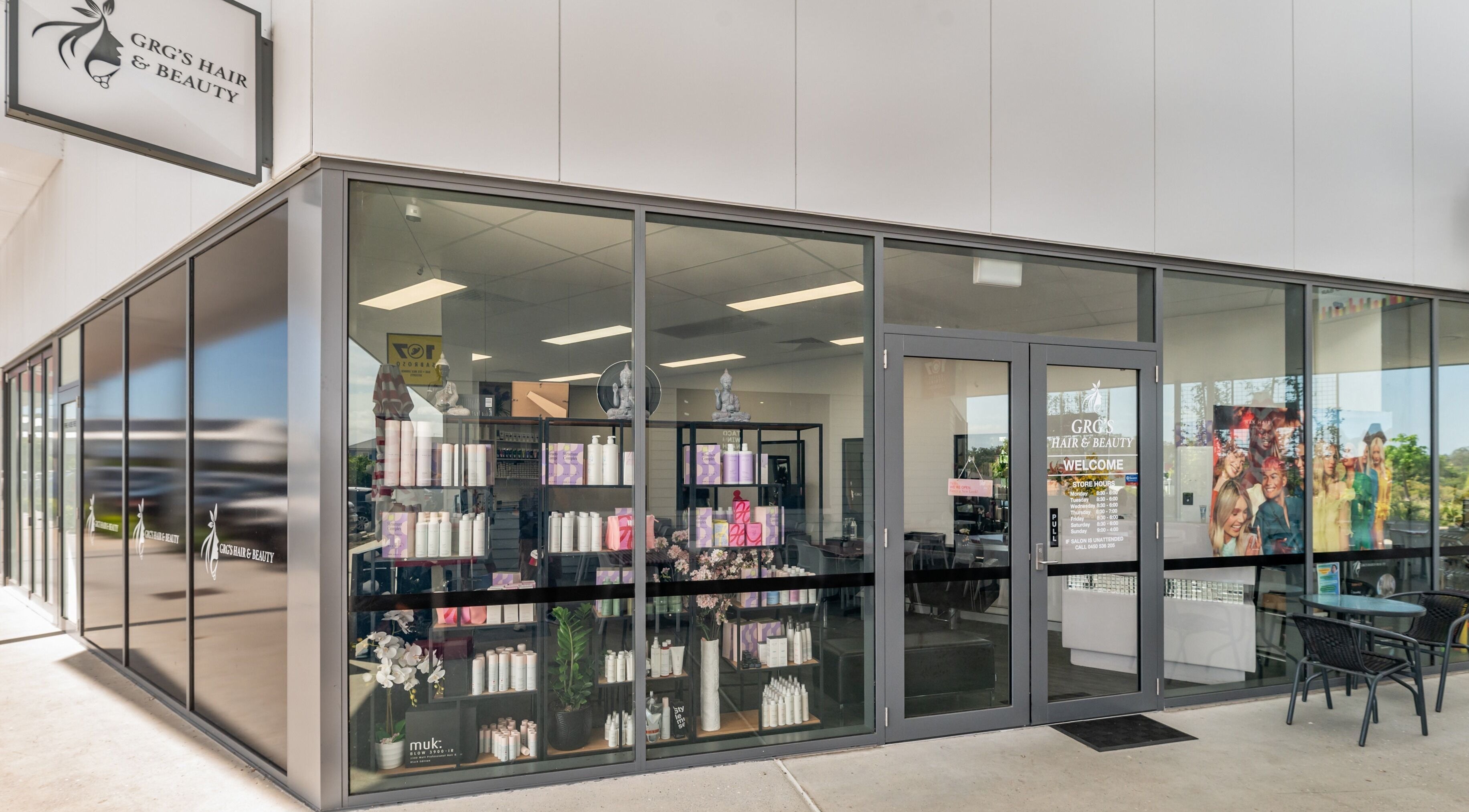 Exterior of GRG’s Hair & Beauty in Spring Mountain, Queensland, AU, showcasing modern design and product displays.