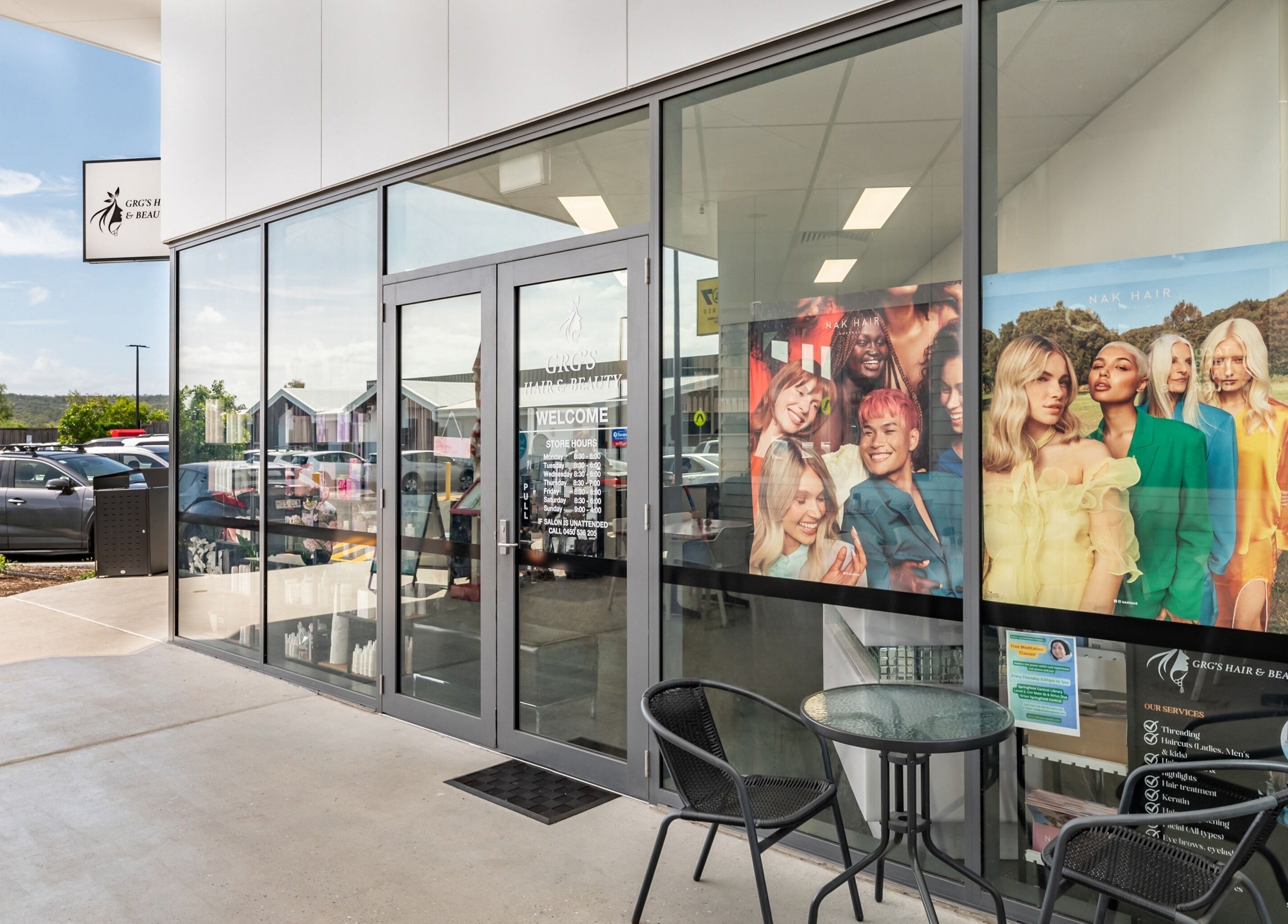 Front view of GRG’s Hair & Beauty in Spring Mountain, Queensland, AU with stylish window poster.