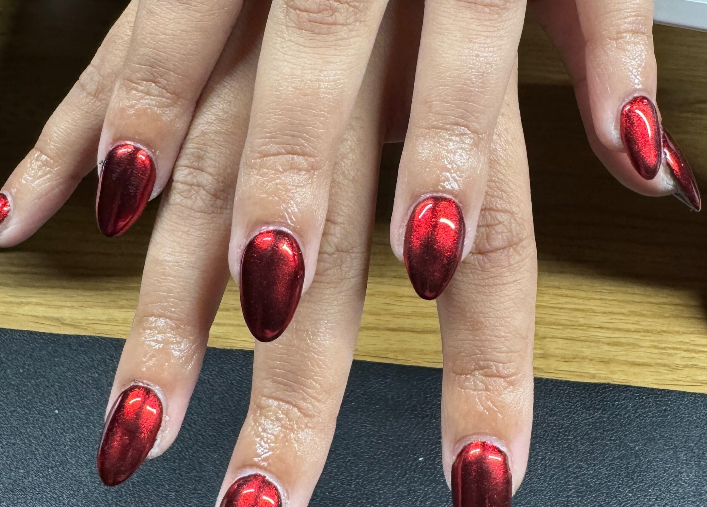 Crimson red manicure at Bullet Beauty Bar, Meadow Springs, Western Australia, AU showcases expert nail artistry.