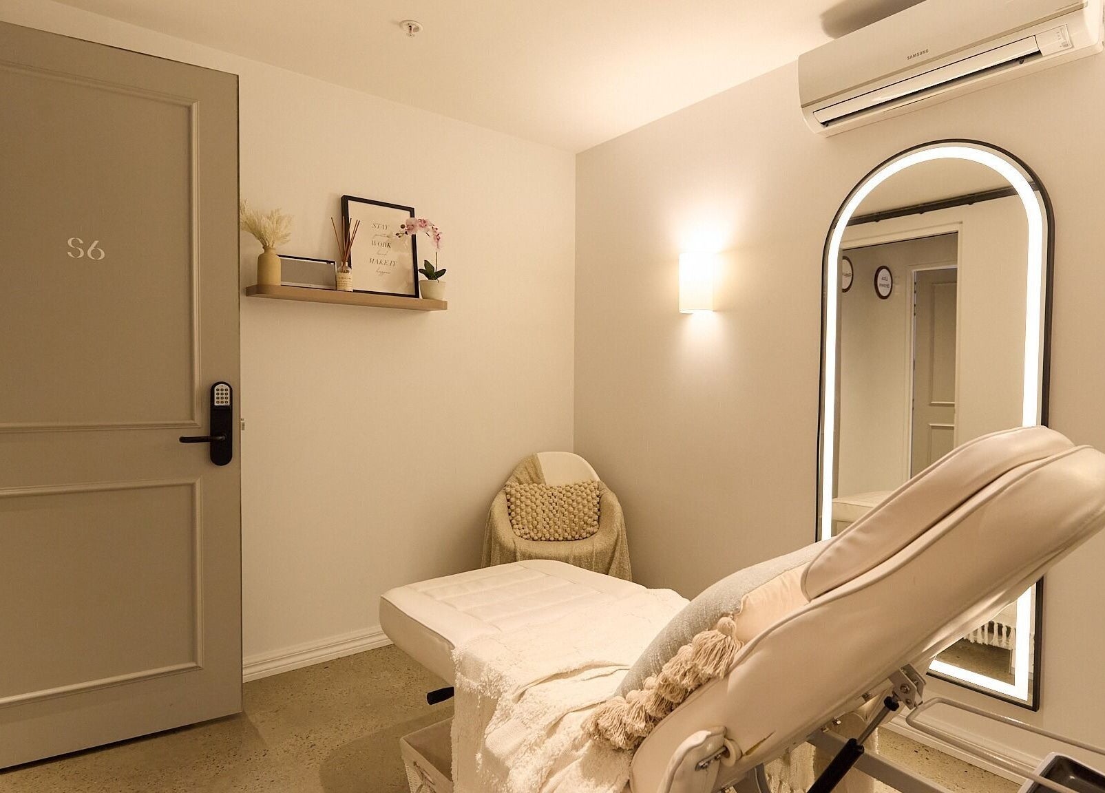 Rejuvee's serene treatment room in Surry Hills, New South Wales, AU, featuring plush seating and a soft-lit ambiance.