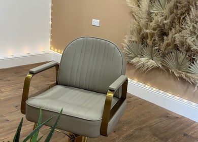 Chic salon chair at Goddess Rising Hair Extensions, Belper, England, GB, surrounded by elegant decor.