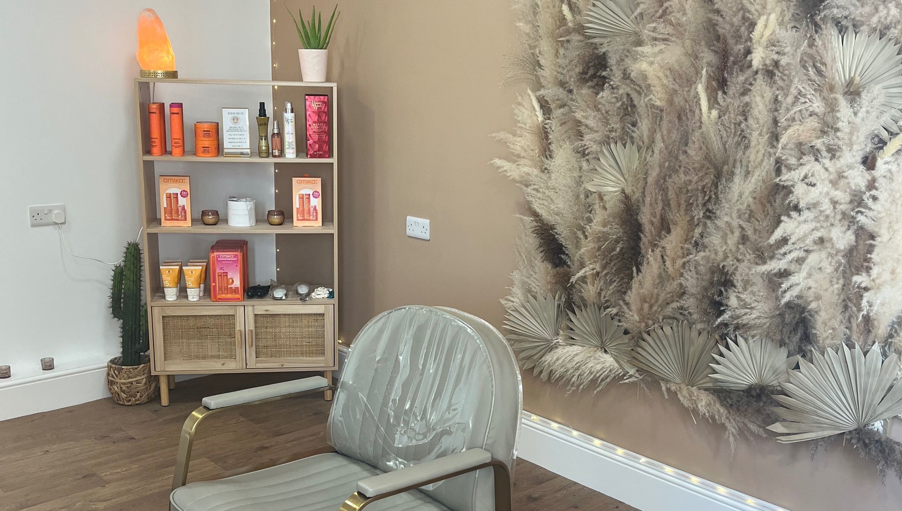 Stylish salon corner at Goddess Rising Hair Extensions, Belper, England, GB featuring chic decor and hair products.