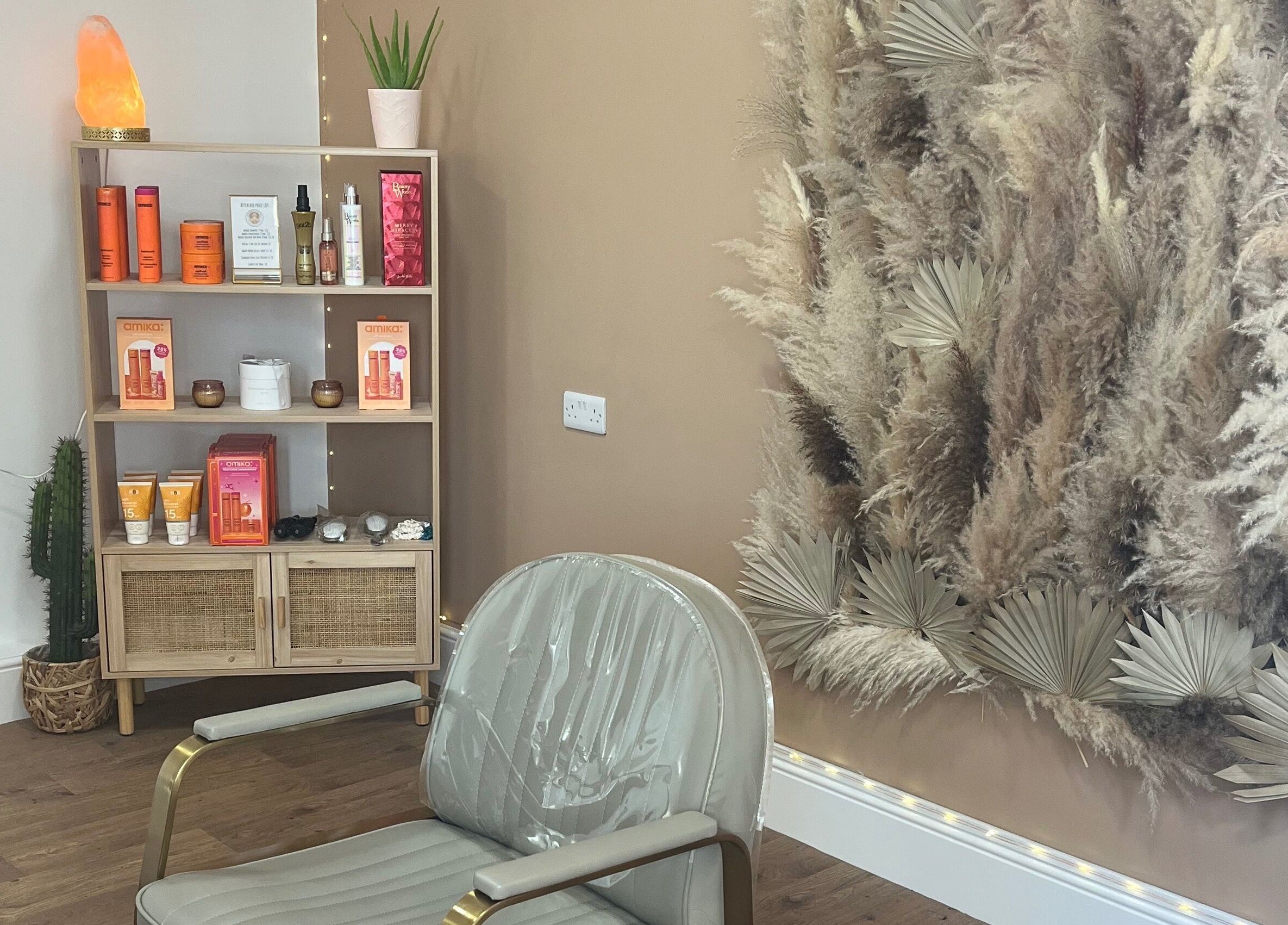 Stylish salon corner at Goddess Rising Hair Extensions, Belper, England, GB featuring chic decor and hair products.