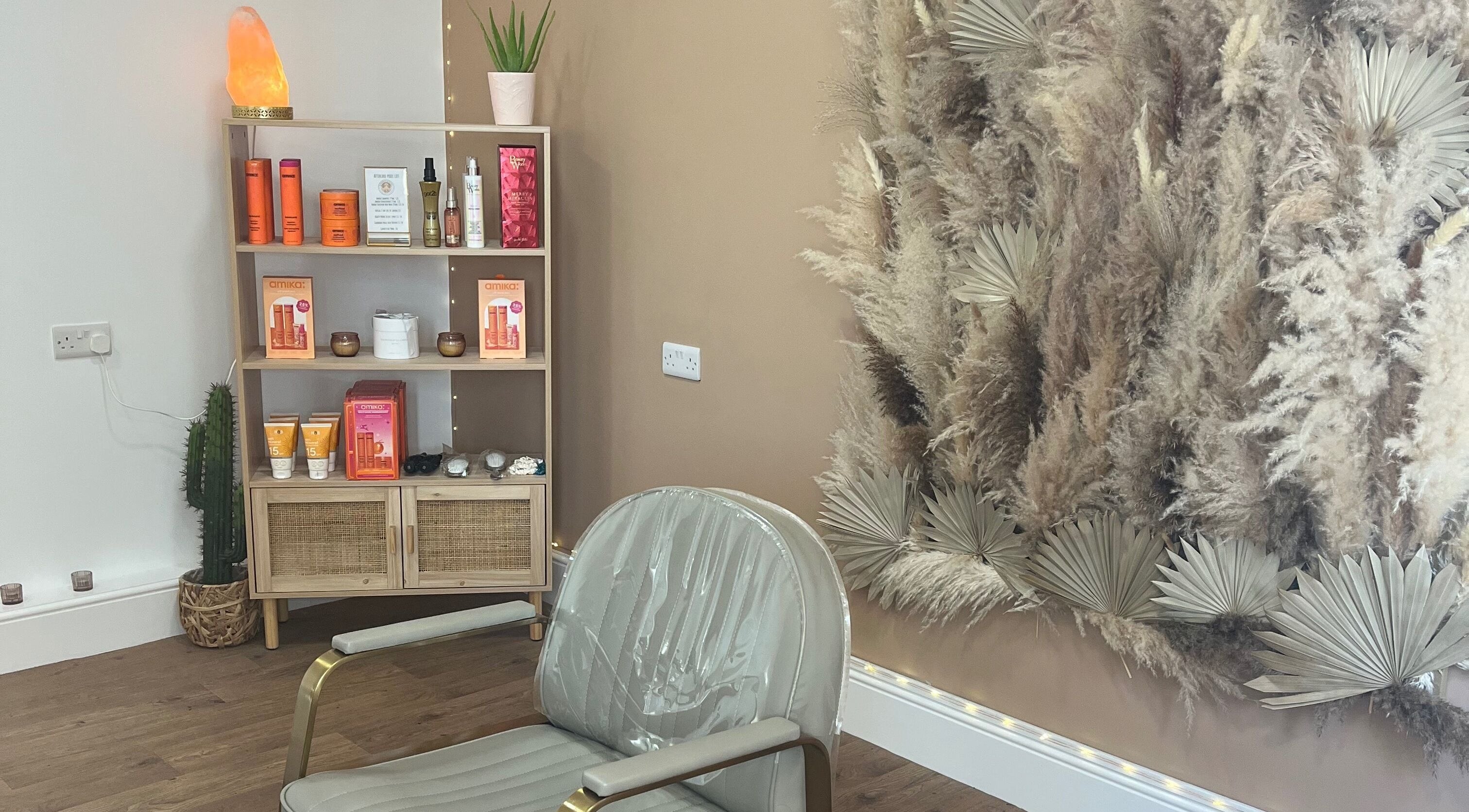 Stylish salon corner at Goddess Rising Hair Extensions, Belper, England, GB featuring chic decor and hair products.