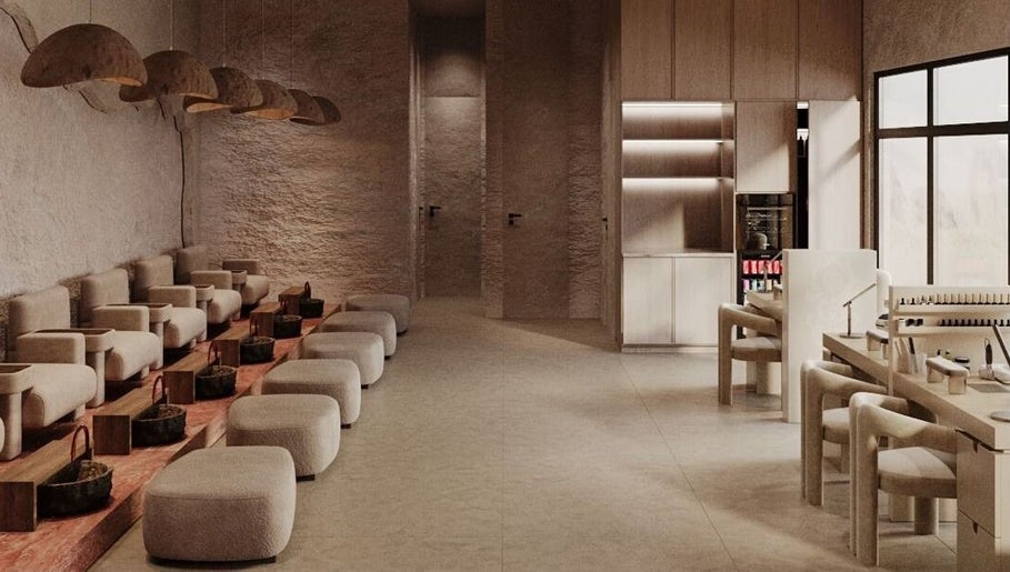 Elegant interior of Coated Beauty Lounge in Ras Al-khaimah, featuring plush seating and modern decor.