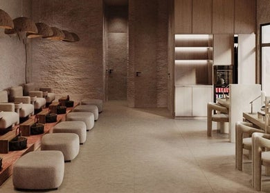 Elegant interior of Coated Beauty Lounge in Ras Al-khaimah, featuring plush seating and modern decor.