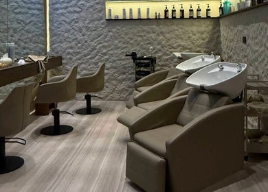 Elegant salon chairs and washbasins at Coated Beauty Lounge in Ras Al-khaimah, Ras Al Khaimah, AE.