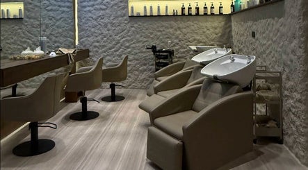 Elegant salon chairs and washbasins at Coated Beauty Lounge in Ras Al-khaimah, Ras Al Khaimah, AE.