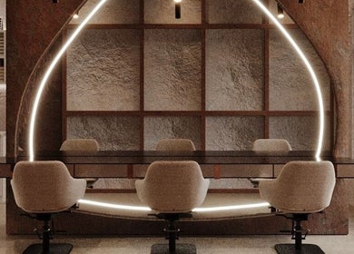 Chic interior of Coated Beauty Lounge in Ras Al-khaimah, Ras Al Khaimah, AE with modern seating and lighting.