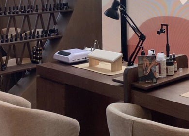 Elegant nail care station at Coated Beauty Lounge, Ras Al-khaimah, Ras Al Khaimah, AE, with modern decor.