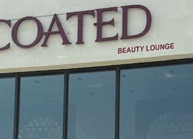Facade of Coated Beauty Lounge in Ras Al-khaimah, Ras Al Khaimah, AE with stylish signage.