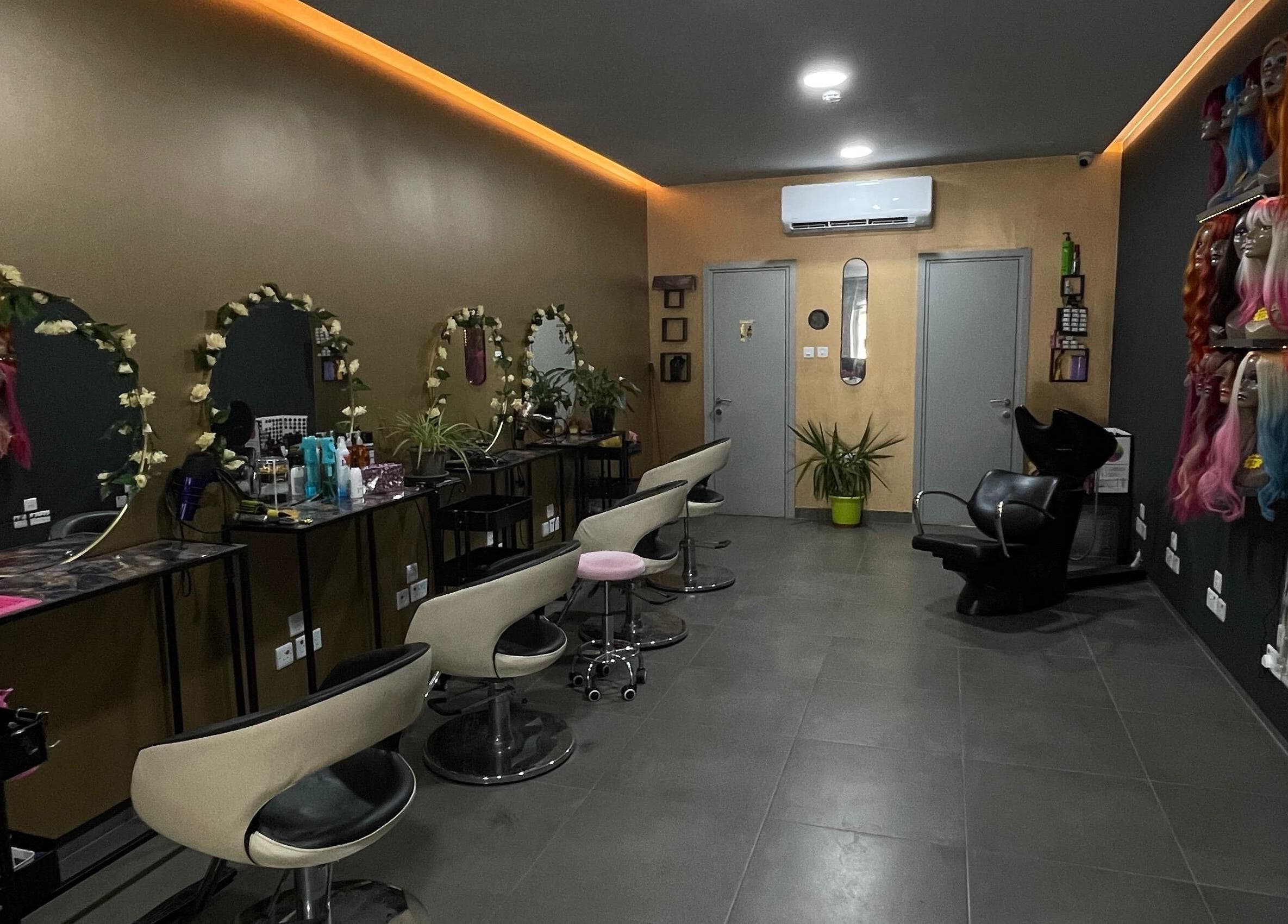 Stylish salon interior at Hair Extensions by Yasmin Fgura, Il-fgura, MT, showcasing modern chairs and decor.