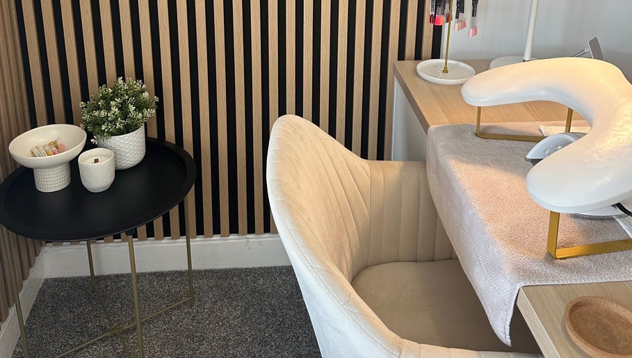 Elegant nail station at Muse Beauty Studio in Port Talbot, Wales, GB, featuring plush chair and minimalist decor.