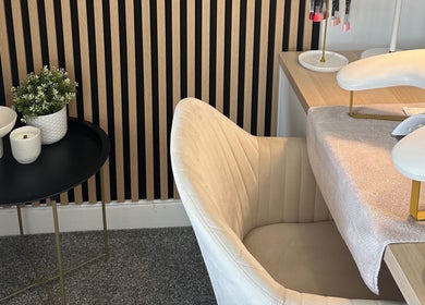 Elegant nail station at Muse Beauty Studio in Port Talbot, Wales, GB, featuring plush chair and minimalist decor.