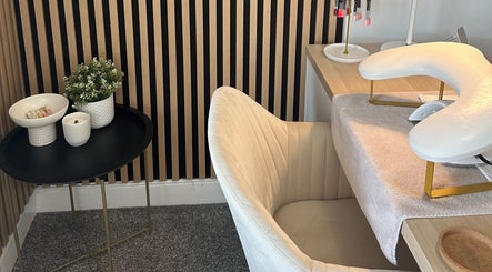 Elegant nail station at Muse Beauty Studio in Port Talbot, Wales, GB, featuring plush chair and minimalist decor.