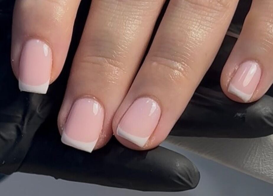 Elegant French manicure at Muse Beauty Studio, Port Talbot, Wales, GB, showcasing professional nail artistry.