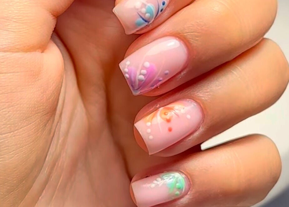 Colorful floral nail art at Muse Beauty Studio, Port Talbot, Wales, GB, showcasing professional nail design.