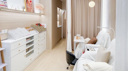 Relaxing beauty corner at The Skin Edit, Singapore, SG, featuring cozy seating and elegant interiors.